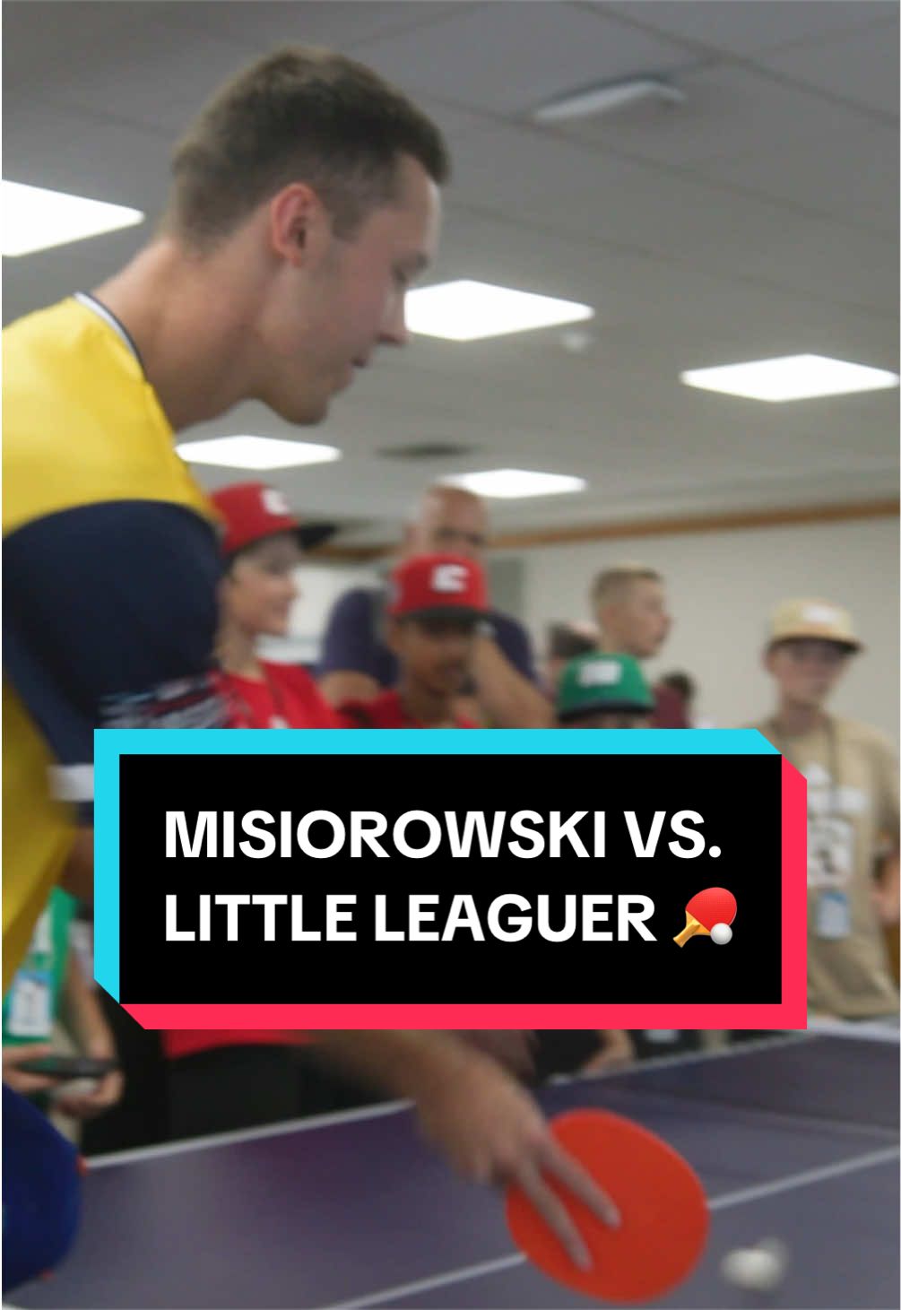 Jacob Misiorowski faces a little leaguer in ping-pong at the 